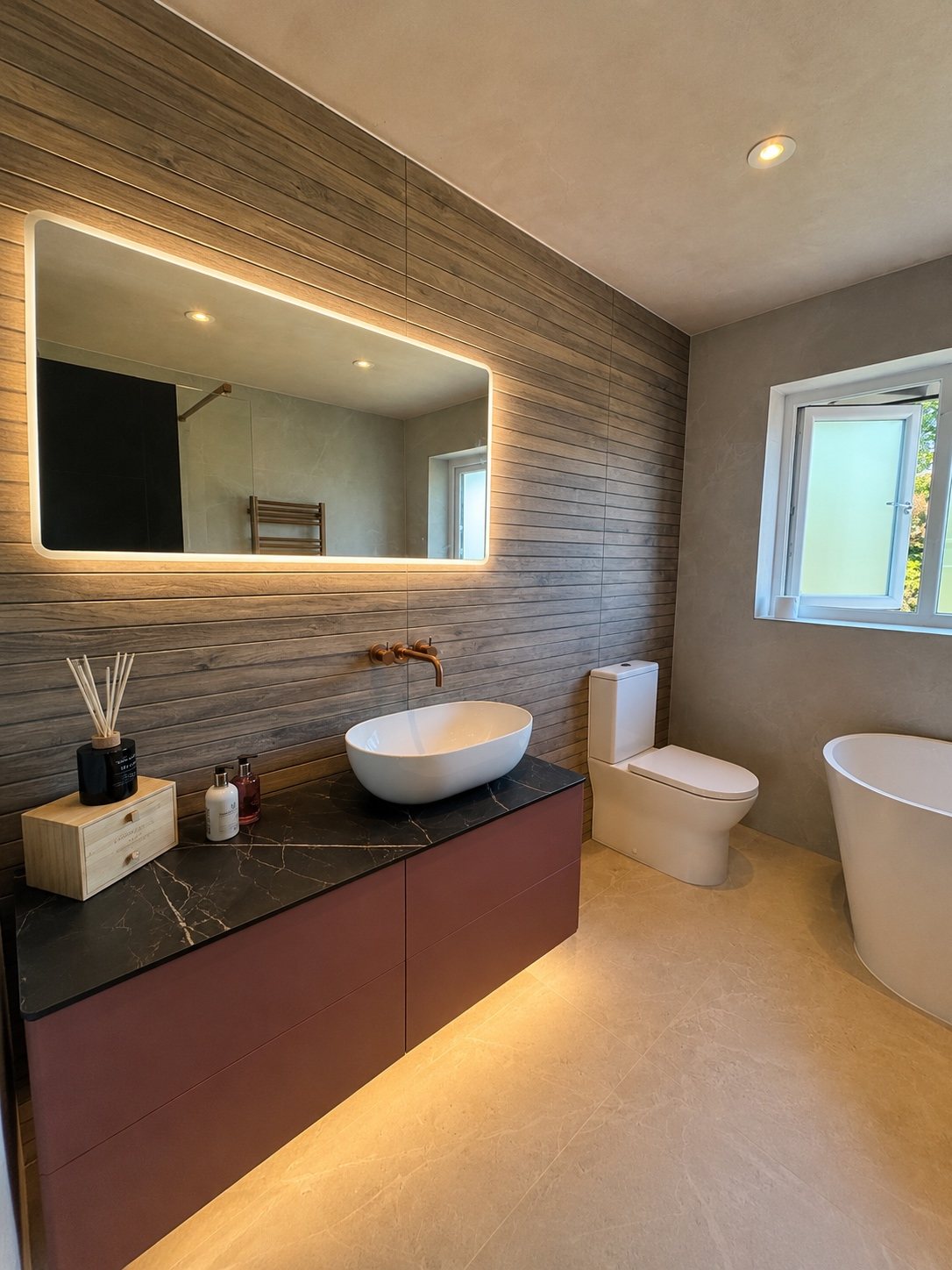 Finished bathroom renovation with vanity and tiling by Black Oak Projects