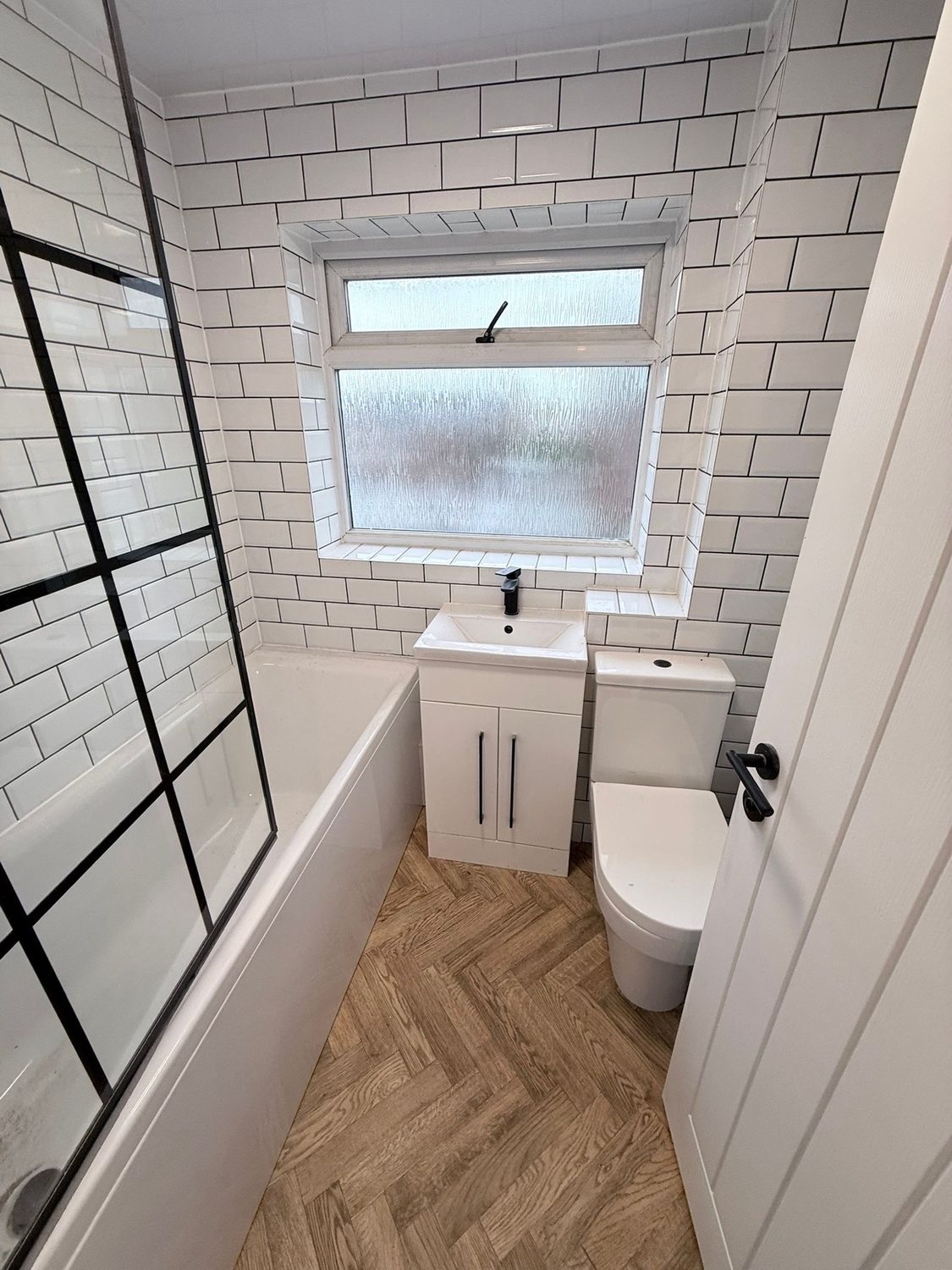 Finished bathroom with vanity and bath