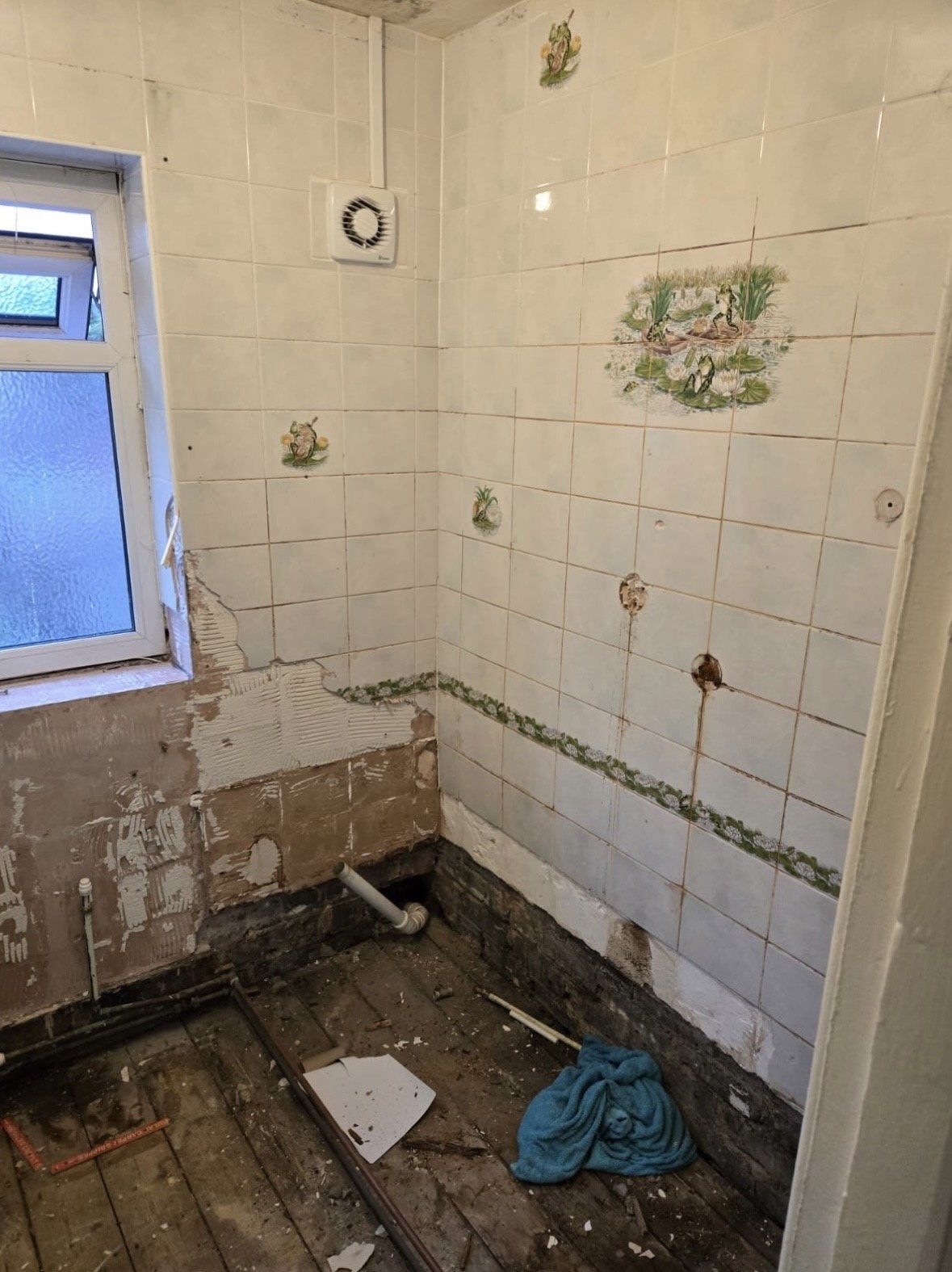 Before: separate old white-tiled bathroom