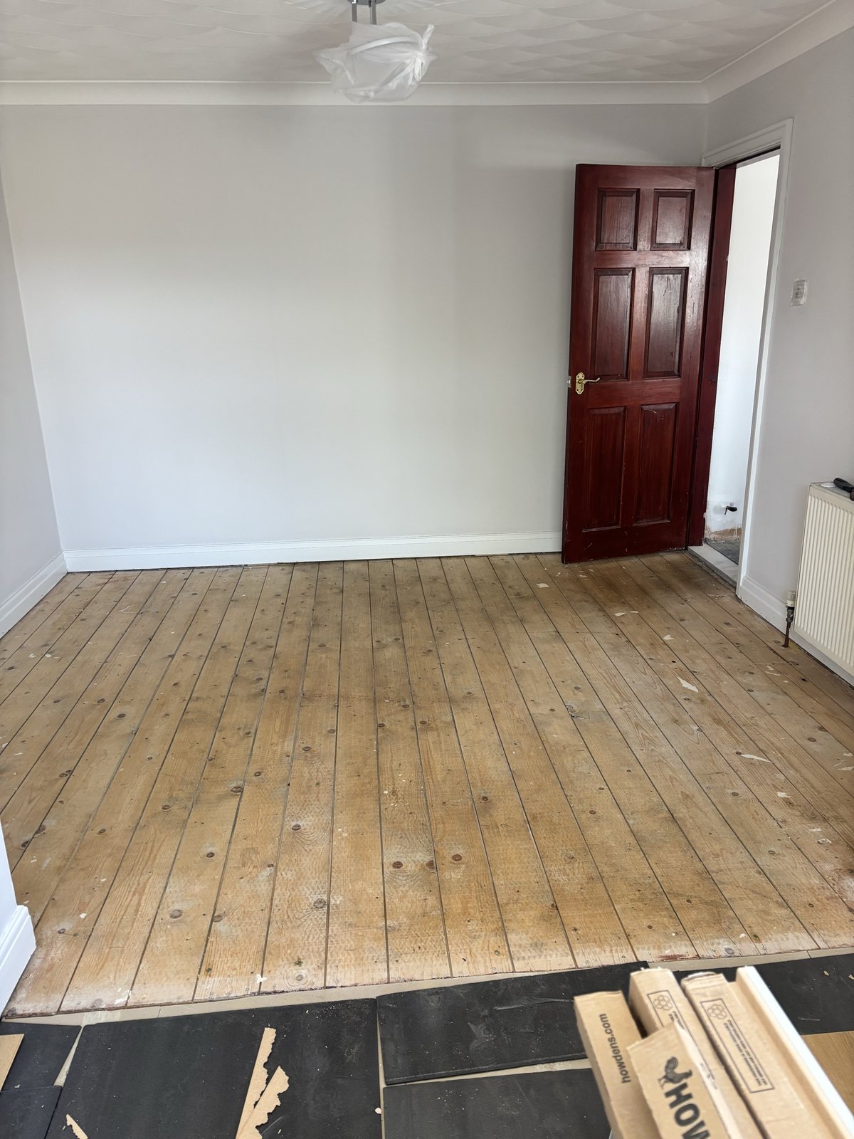 Conservatory before: dining room with old wood floor