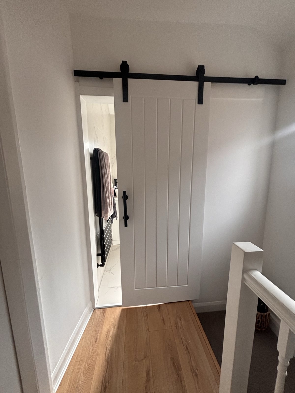 Barn door feature in refurbished room