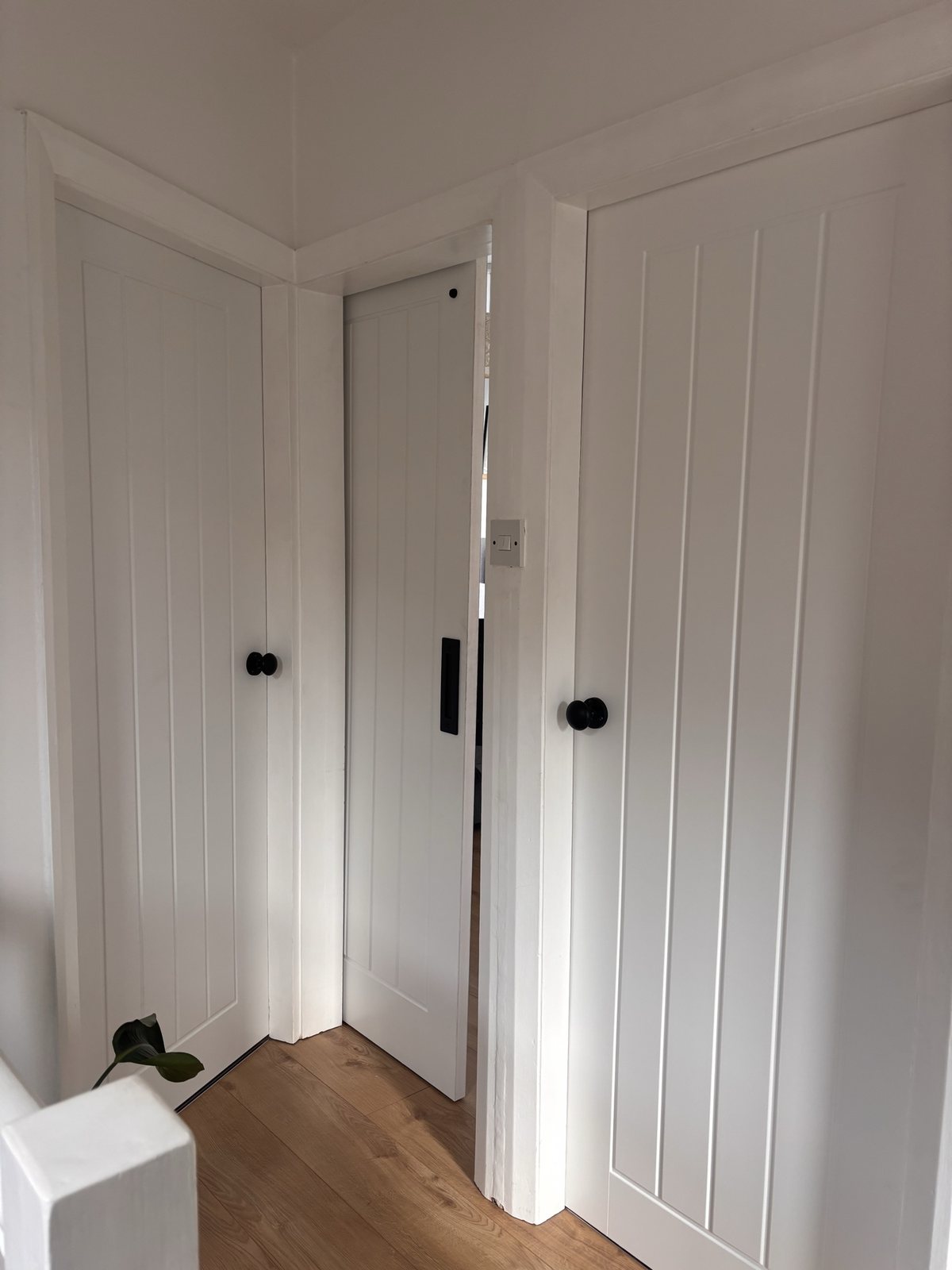 Pocket door detail in refurbished room